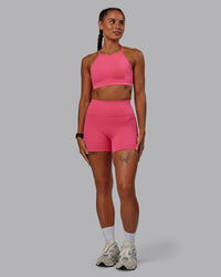 Woman wearing Fusion Ultra High-Rise 4" Short Pockets - Hot Pink | Model:Vanessa | Size:S
