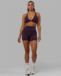 Woman wearing Fusion Ultra High-Rise 4" Short Pockets - Midnight Plum | Model:Gabby | Size:S