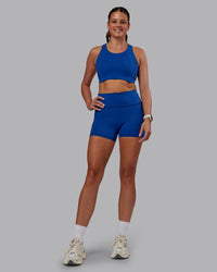 Woman wearing Fusion Ultra High-Rise 4" Short Pockets - Blue Quartz | Model:Phoebe | Size:S