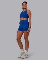 Woman wearing Fusion Ultra High-Rise 4" Short Pockets - Blue Quartz | Model:Phoebe | Size:S