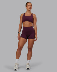Woman wearing Fusion Ultra High-Rise 4" Short Pockets - Cherry Lacquer | Model:Lyss | Size:S