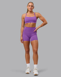 Woman wearing Fusion Ultra High-Rise 4" Short Pockets - Purple Fizz | Model:Shalem | Size:S