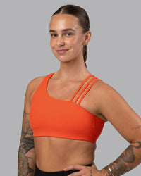 Woman wearing Galvanise Sports Bra 2.0 - Ultra Orange | Model:Robyn | Size:S