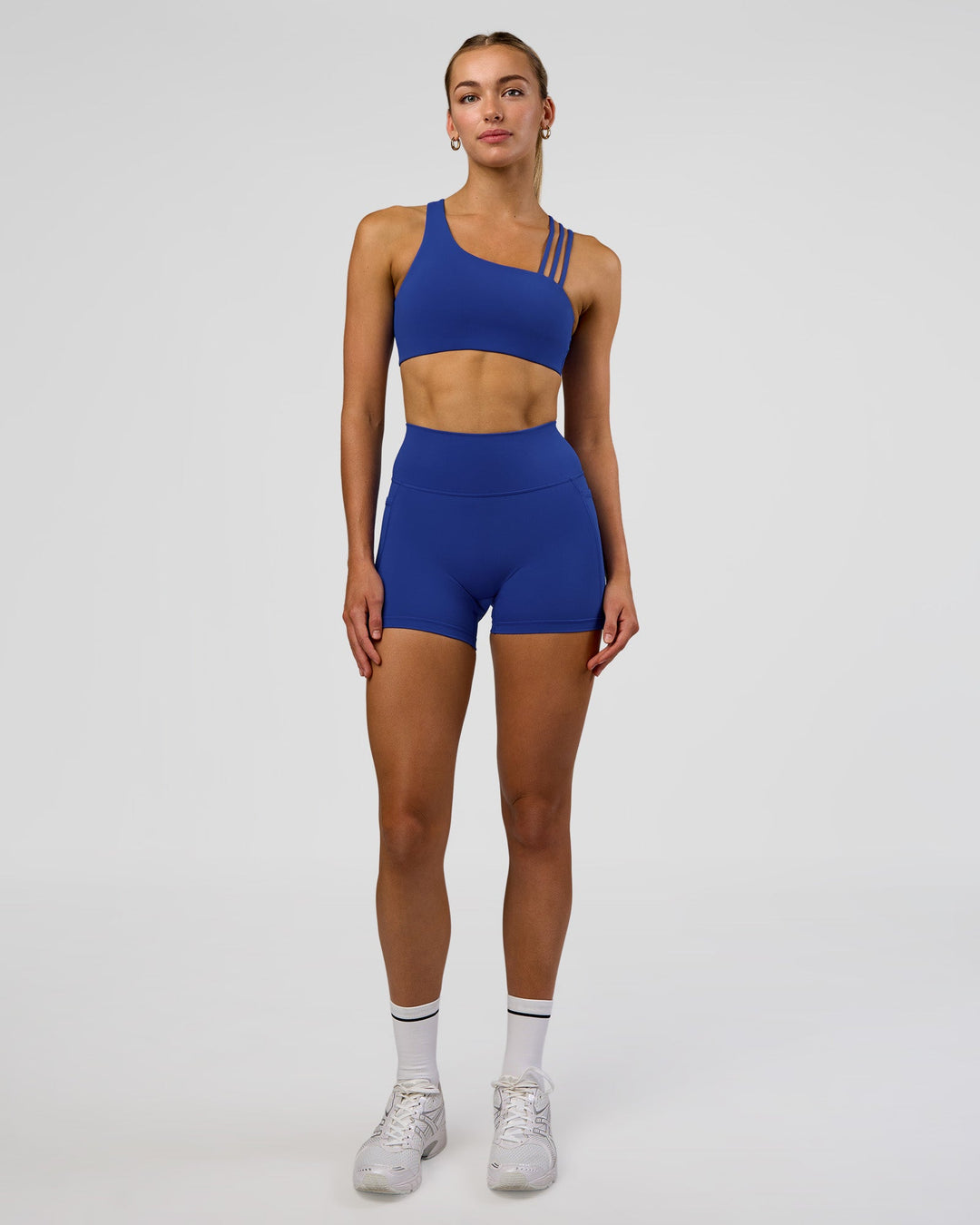 Woman wearing Galvanise Sports Bra 2.0 - Electric Indigo | Model:Evie | Size:S