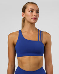Woman wearing Galvanise Sports Bra 2.0 - Electric Indigo | Model:Evie | Size:S