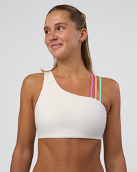 Woman wearing Galvanise Sports Bra 2.0 - Off White-Multi | Model:Amity | Size:S