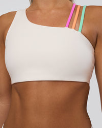Woman wearing Galvanise Sports Bra 2.0 - Off White-Multi | Model:Amity | Size:S