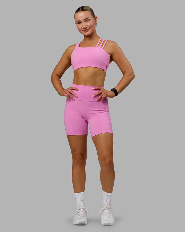 Woman wearing Galvanise Sports Bra - Spark Pink
