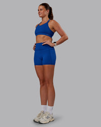 Woman wearing Genesis Layered Sports Bra - Blue Quartz | Model:Phoebe | Size:S