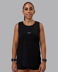 Woman wearing Go-To FLXCotton Longline Tank - Black-White | Size:S | Model:Tylah