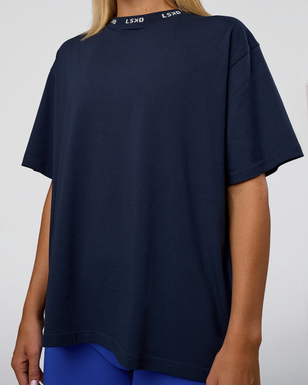 Woman wearing Go-To FLXCotton Oversized Deviation Tee - Future Navy-White | Model:Amity | Size:S