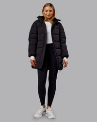 Woman wearing Go-To Puffer Long Jacket - Black | Model:Ella | Size:S