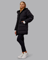 Woman wearing Go-To Puffer Long Jacket - Black | Model:Ella | Size:S