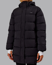 Woman wearing Go-To Puffer Long Jacket - Black | Model:Ella | Size:S