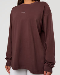 Woman wearing Go-To Long Sleeve FLXCotton Oversized Tee - Cocoa Powder-White | Model:Bianca | Size:S
