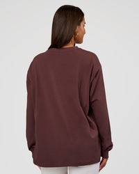 Woman wearing Go-To Long Sleeve FLXCotton Oversized Tee - Cocoa Powder-White | Model:Bianca | Size:S