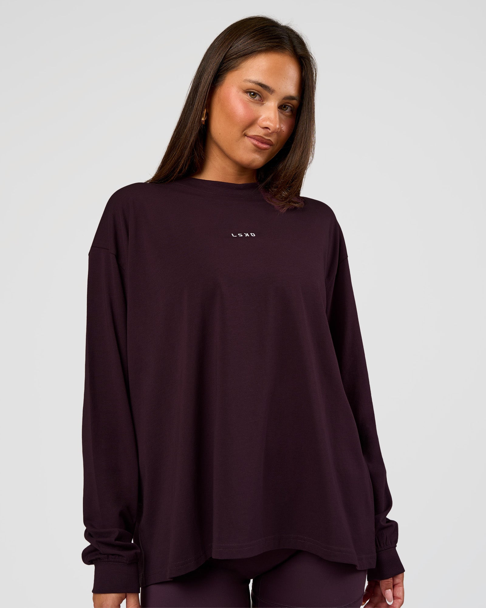 Woman wearing Go-To Long Sleeve FLXCotton Oversized Tee - Midnight Plum-White | Model:Bianca | Size:S
