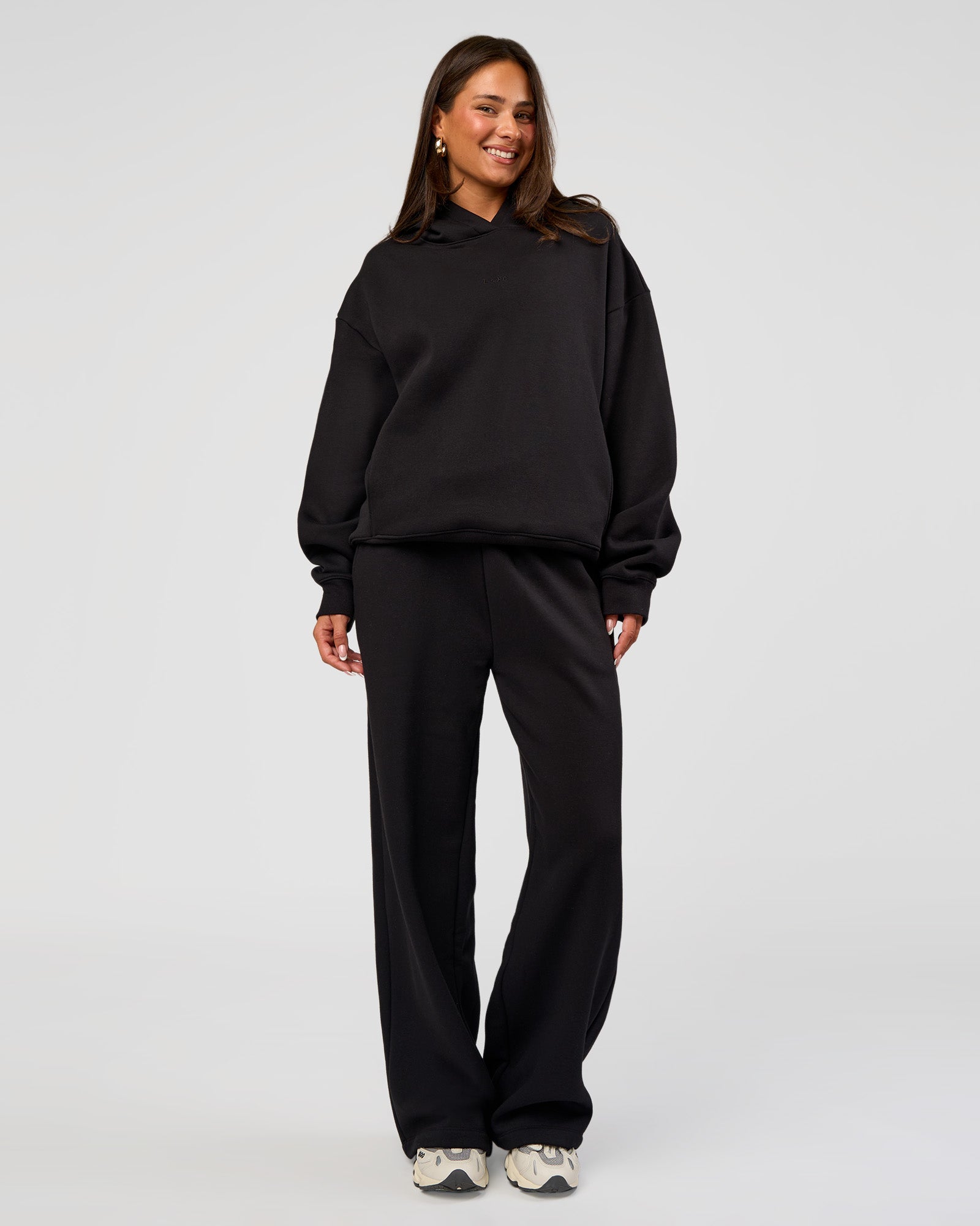 Woman wearing Go-To Oversized Hoodie - Black | Model:Bianca | Size:S