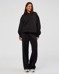 Woman wearing Go-To Oversized Hoodie - Black | Model:Bianca | Size:S