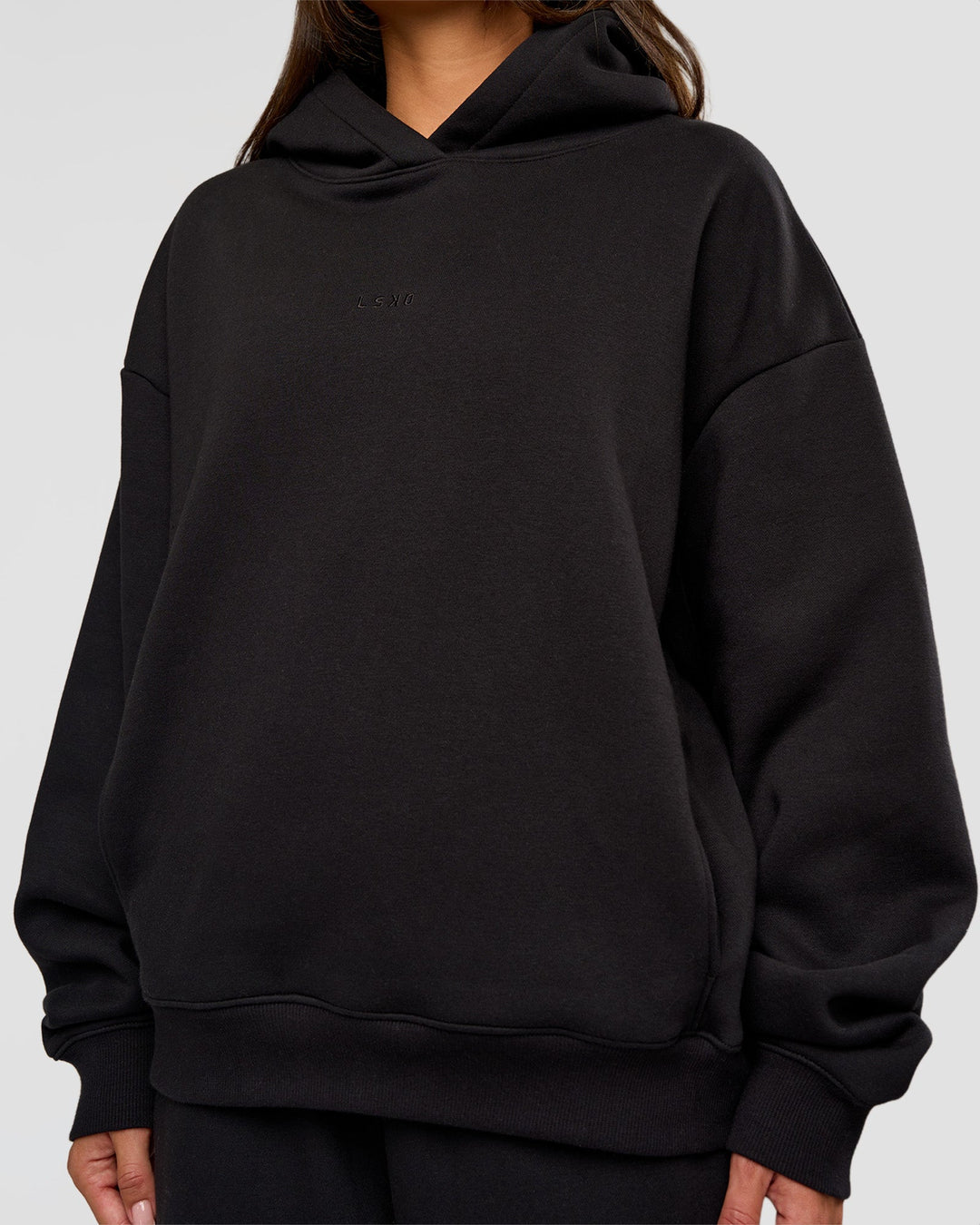Woman wearing Go-To Oversized Hoodie - Black | Model:Bianca | Size:S