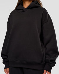 Woman wearing Go-To Oversized Hoodie - Black | Model:Bianca | Size:S