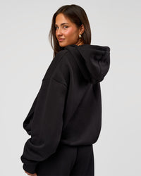Woman wearing Go-To Oversized Hoodie - Black | Model:Bianca | Size:S