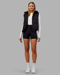 Woman wearing Go-To Puffer Vest - Black | Model:Ella | Size:S