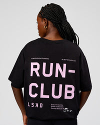 Woman wearing Go-To Run Club FLXCotton Oversized Tee - Black-Marshmallow | Model:Ellie | Size:S