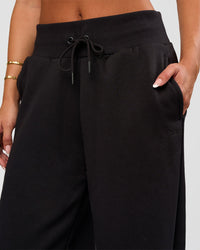Woman wearing Go-To Wide Leg Track Pant - Black | Model:Bianca | Size:S