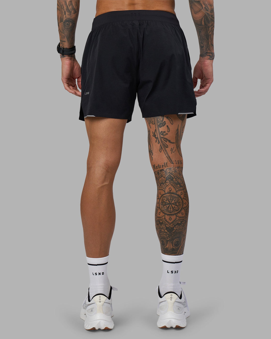 Man wearing Hybrid 5&quot; Short - Black-Reflective | Model:Tommy | Size:S