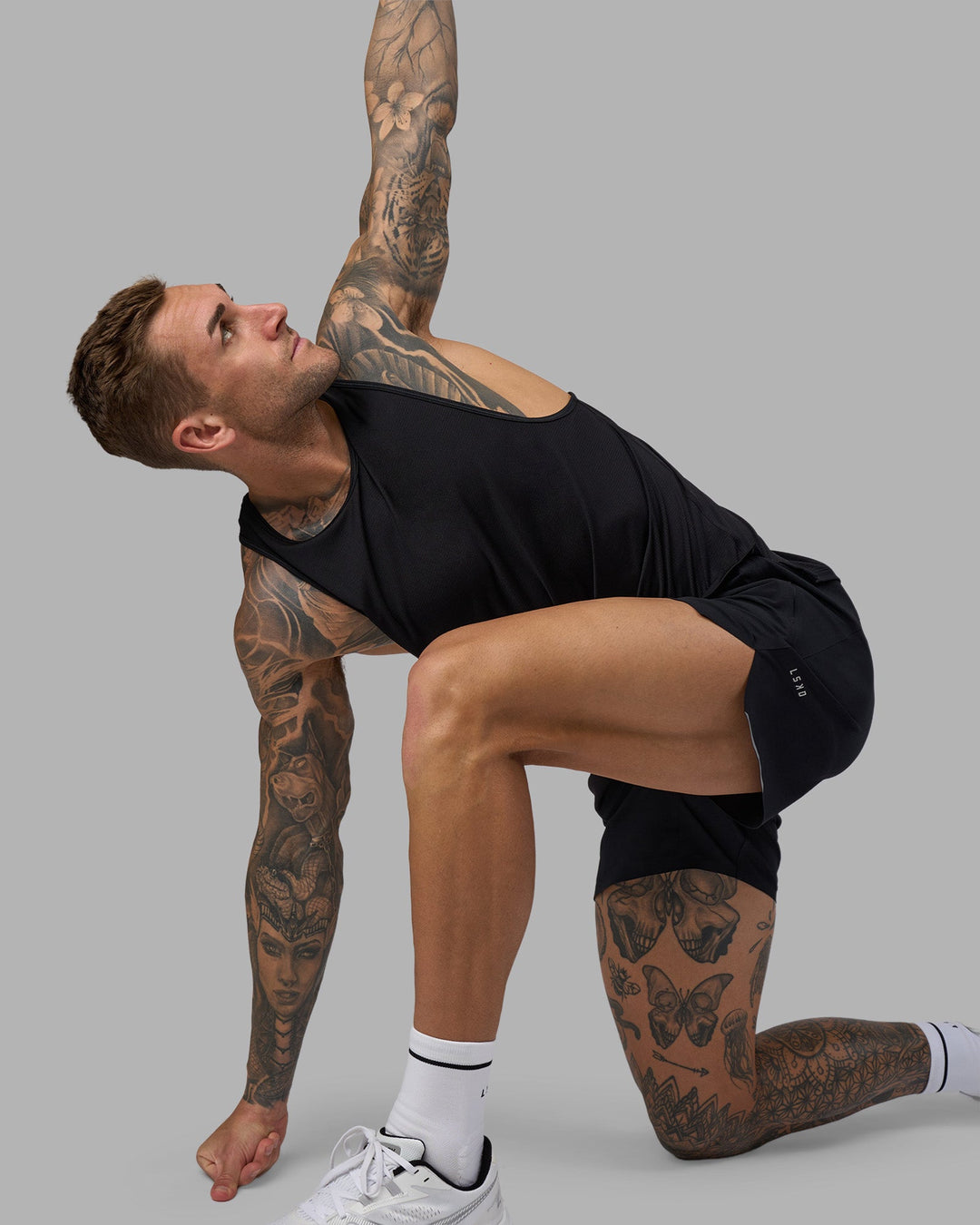 Man wearing Hybrid 5&quot; Short - Black-Reflective | Model:Tommy | Size:S