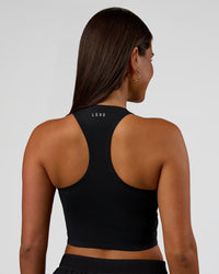 Woman wearing Hybrid Performance Crossover Tank - Black | Model:Bianca | Size:S