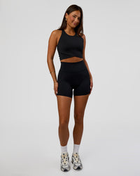 Woman wearing Hybrid Performance Crossover Tank - Black | Model:Bianca | Size:S