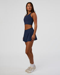 Woman wearing Hybrid Performance Crossover Tank - Future Navy | Model:Bianca | Size:S