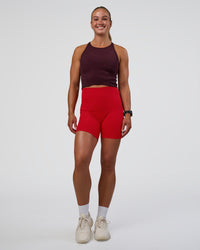Woman wearing Ignite High Neck Tank - Cherry Lacquer | Model:Sav | Size:S