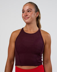 Woman wearing Ignite High Neck Tank - Cherry Lacquer | Model:Sav | Size:S