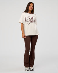 Woman wearing LSKD Fitness Club Heavyweight Oversized Tee - Off White-Cocoa Powder | Model:Bianca | Size:S