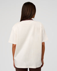 Woman wearing LSKD Fitness Club Heavyweight Oversized Tee - Off White-Cocoa Powder | Model:Bianca | Size:S