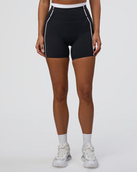 Woman wearing Liberate Contrast High-Rise 6" Short Pockets - Black-White | Model:Bianca | Size:S