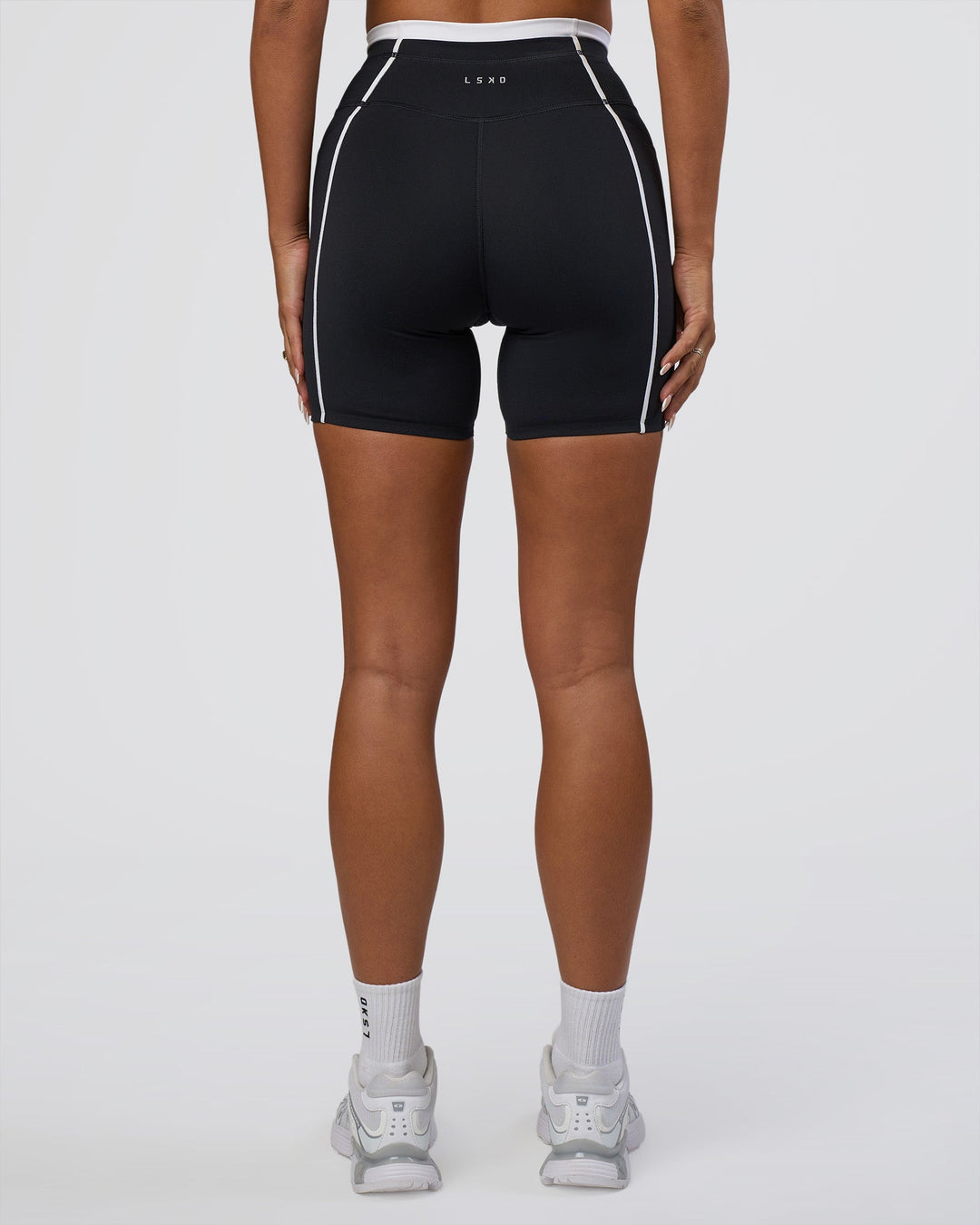 Woman wearing Liberate Contrast High-Rise 6" Short Pockets - Black-White | Model:Bianca | Size:S