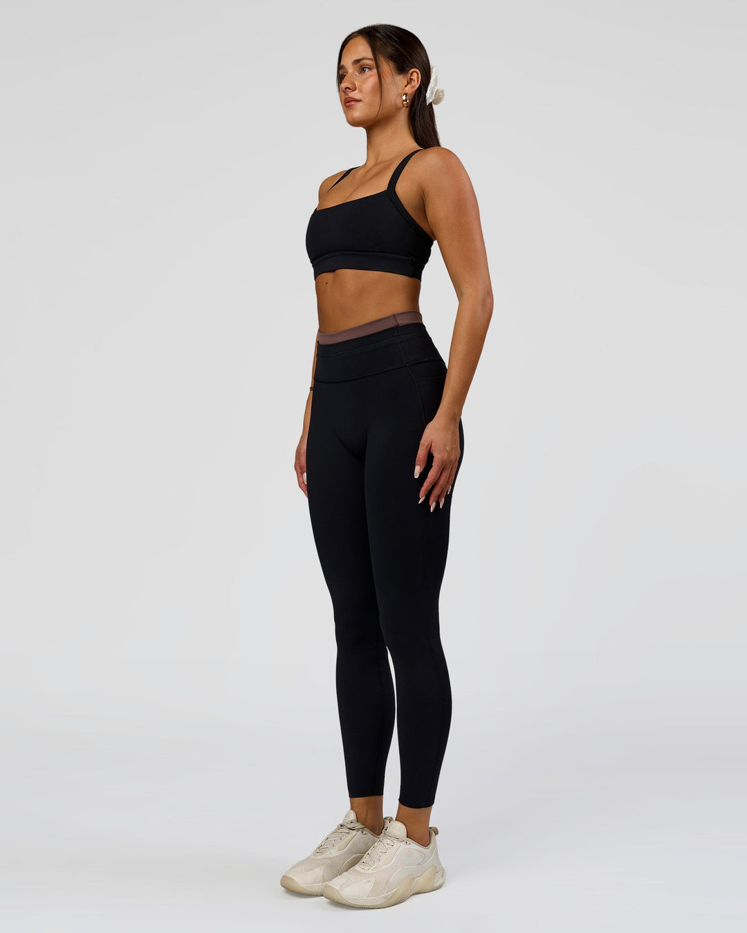 Woman wearing Liberate High-Rise Full Length Legging Pockets in Black-Cocoa Powder | Model:Bianca | Size:S