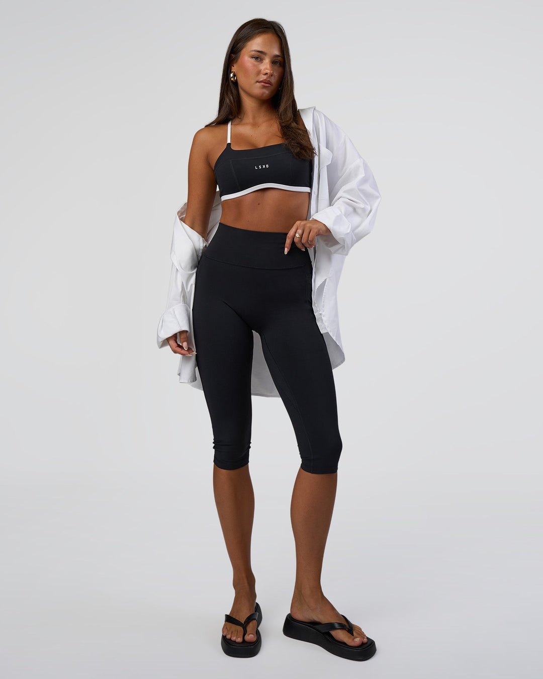 Woman wearing Liberate Sports Bra - Black-White | Model:Bianca | Size:S