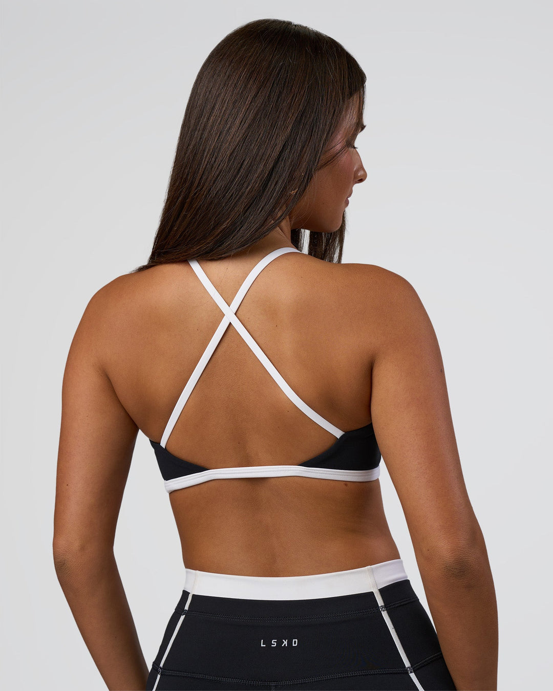 Woman wearing Liberate Sports Bra - Black-White | Model:Bianca | Size:S