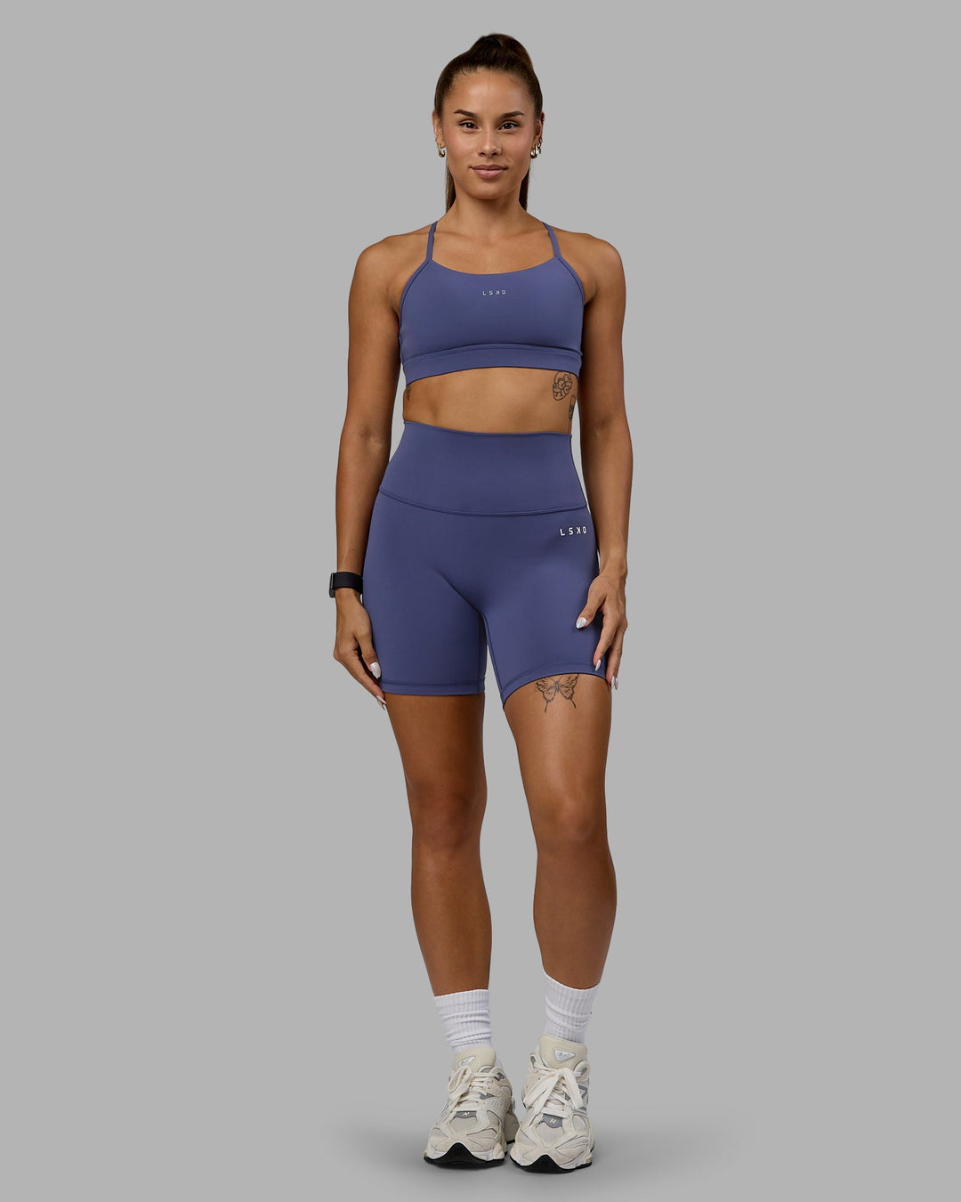 Woman wearing Lift Sports Bra - Future Dusk