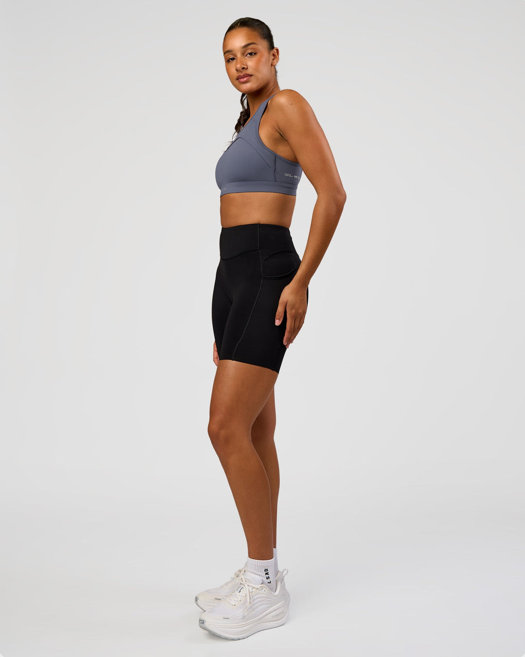 Woman wearing LimitLift Sports Bra - Night Shadow | Model:Rosie | Size:S