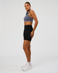 Woman wearing LimitLift Sports Bra - Night Shadow | Model:Rosie | Size:S