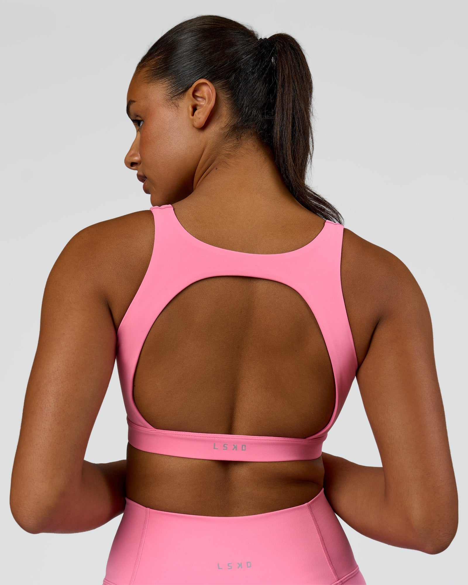 Model wearing Limitless Sports Bra - Candy Pink | Model:Rosie | Size:S