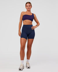 Woman wearing Lively Seamless Ribbed Sports Bra - Future Navy-Ultra Fuchsia | Model:Amity | Size:S