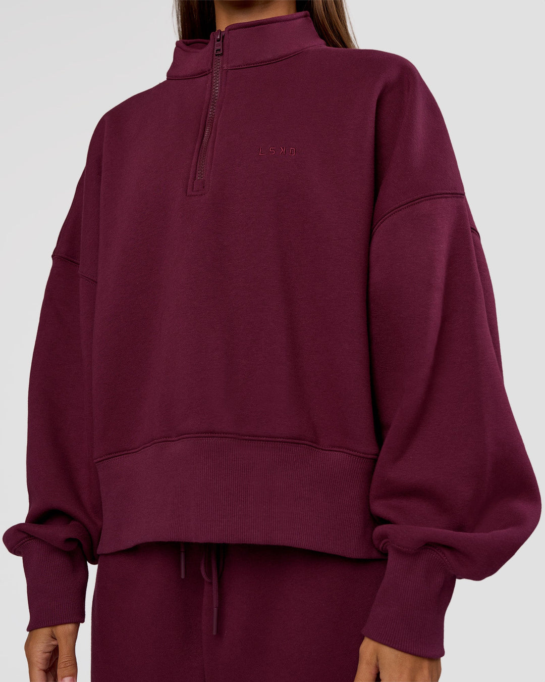 Woman wearing MVP 1/2 Zip Oversized Sweater - Cherry Lacquer | Model:Brylee | Size:S