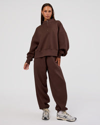 Woman wearing MVP 1/2 Zip Oversized Sweater - Hot Chocolate | Model:Brylee | Size:S